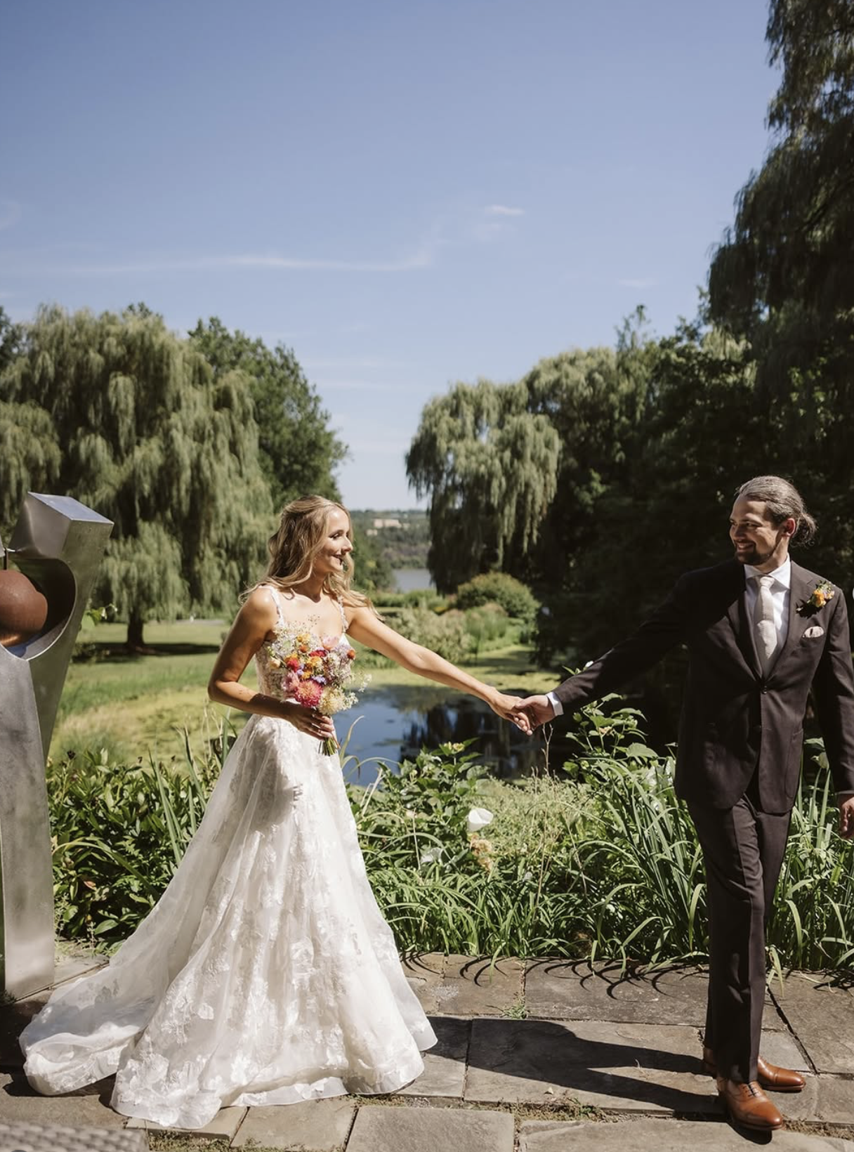 Newlyweds by the pond